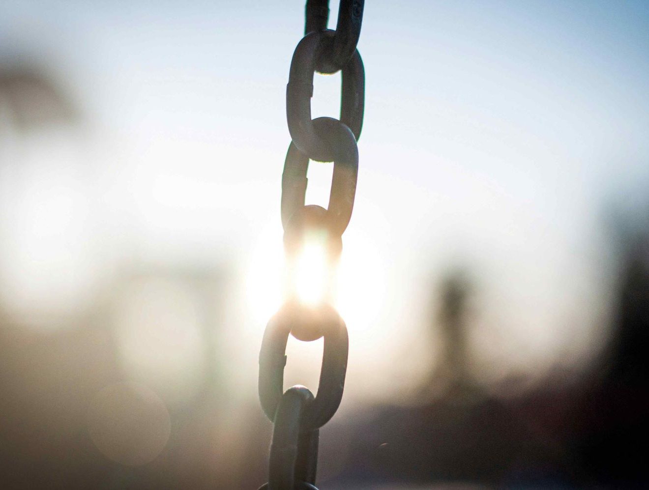 Sunlight obscuring view of a chain