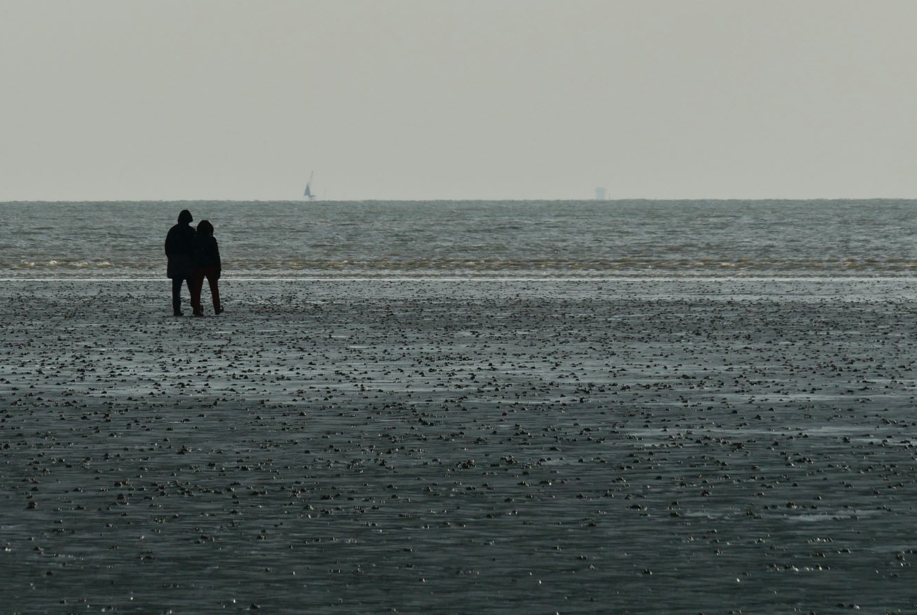Picture of two people at the sea shore